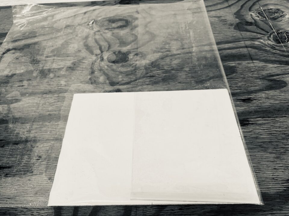 Fold vinyl over wet stacked paper.