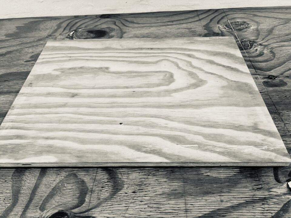 Place the heavy board on top of the wetpack.